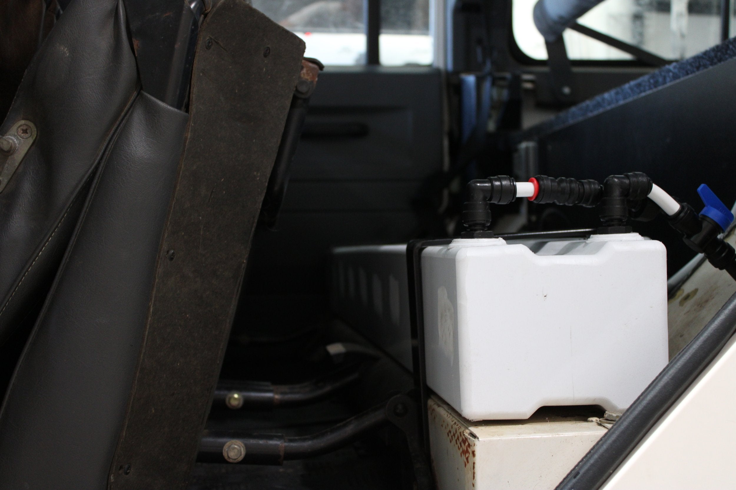 Defender Water tank under seat